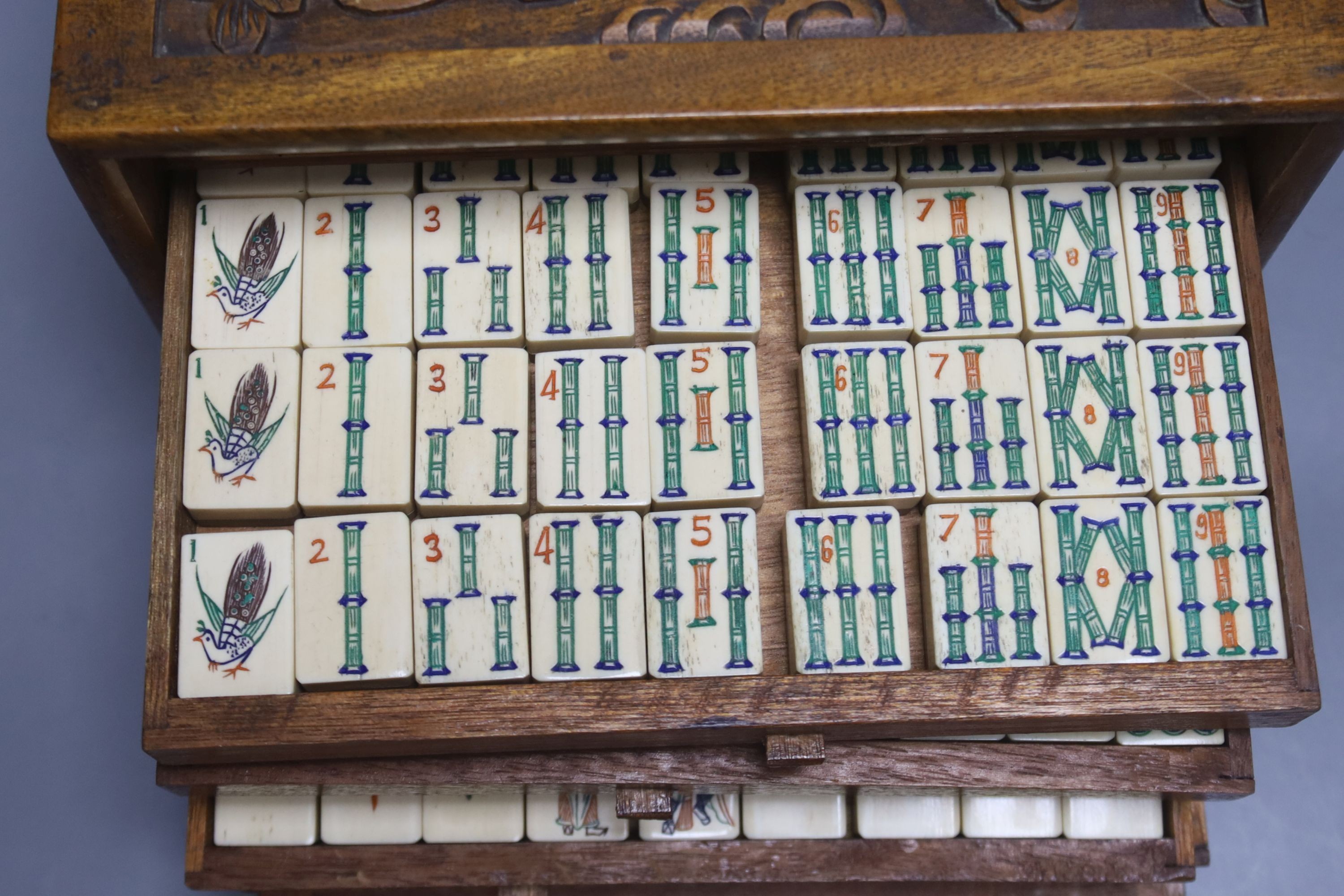 A Chinese hardwood cased mah jong set